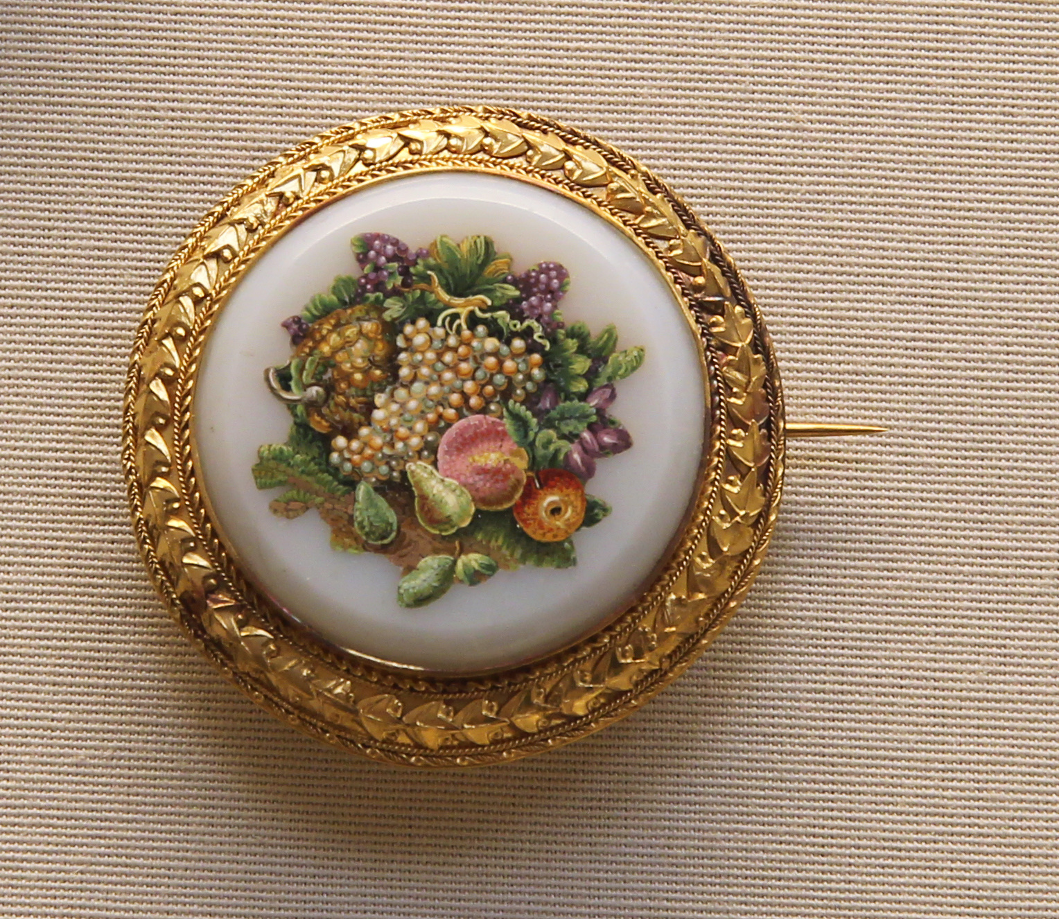 Gold brooch with a micromosaic arrangement of grapes, peaches, plums and flowers by Gioacchino Barberi